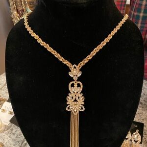 Brighton gold tone with dramatic rhinestone and long chain statement pendant